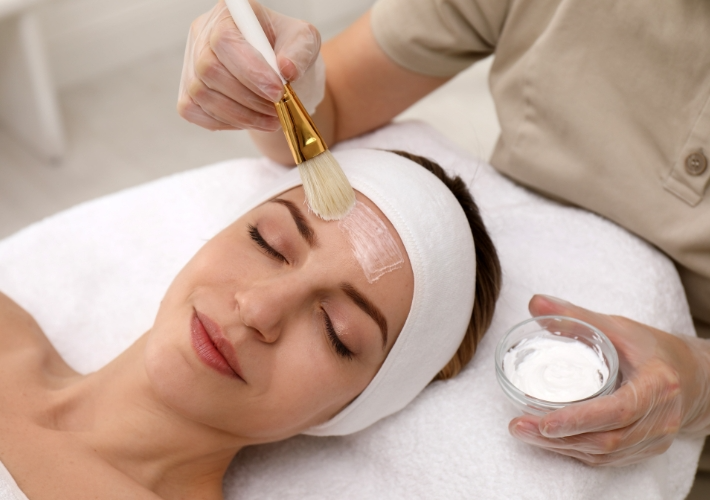 Young Woman is Having Facial in Clinic