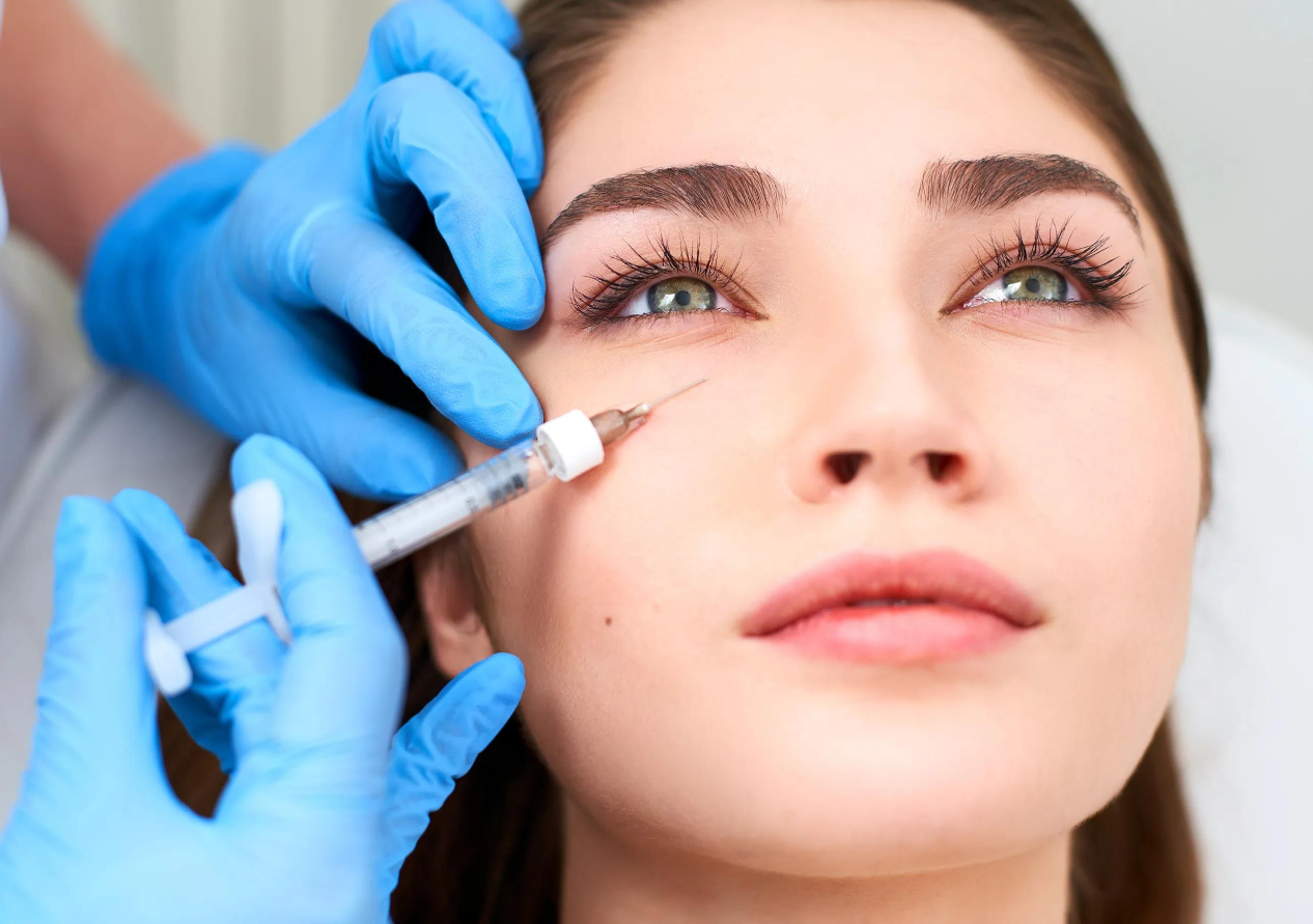 A Young Woman is Getting Injections Under Her Eyes
