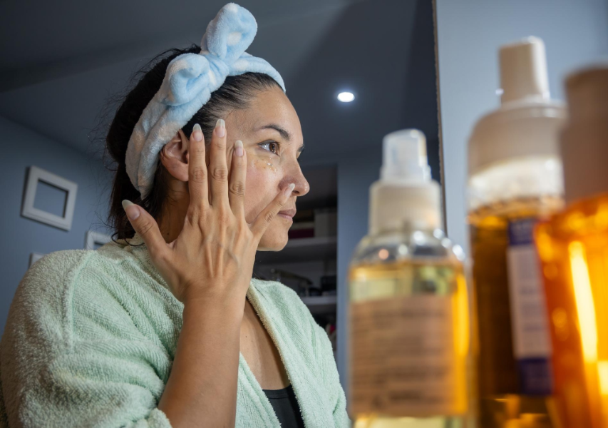 Woman Rubbing Serum on Face