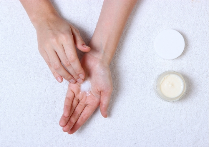 Woman Hands with Some Skin Cream