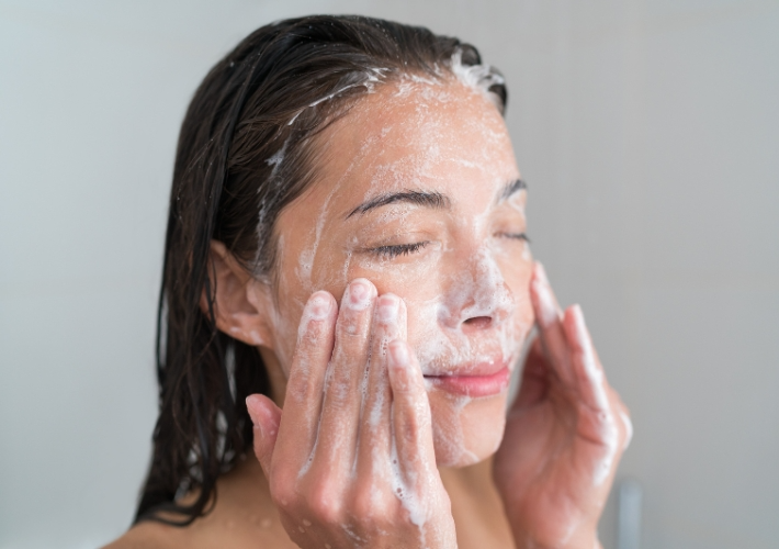 Woman is Cleaning her Face