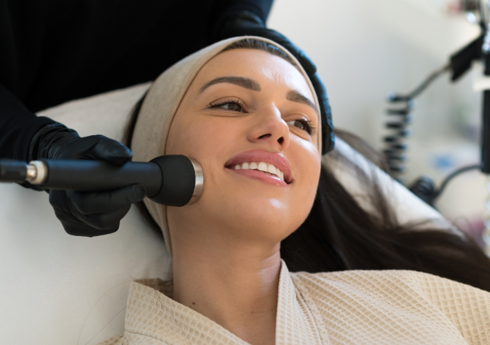 Smiling Young Woman is Getting HydraFacial